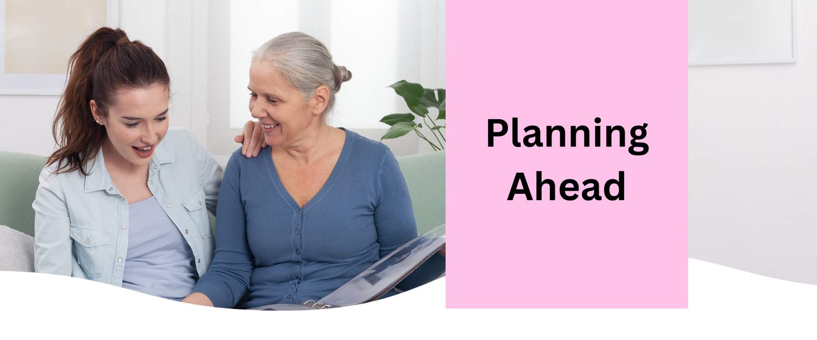 A carer reading to her grandmother